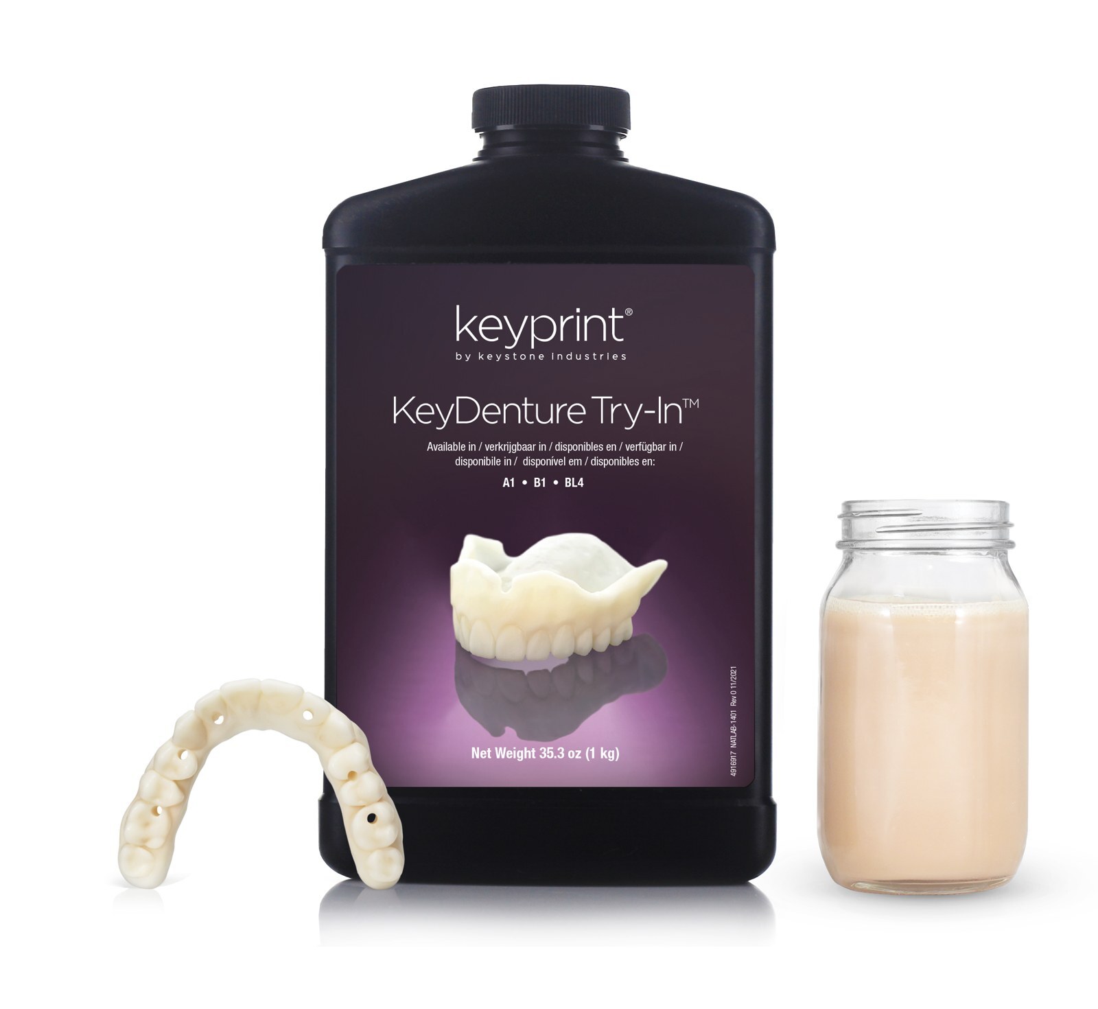 Frasco da resina KeyDenture Try-In da Keystone ao lado de uma prótese de prova impressa