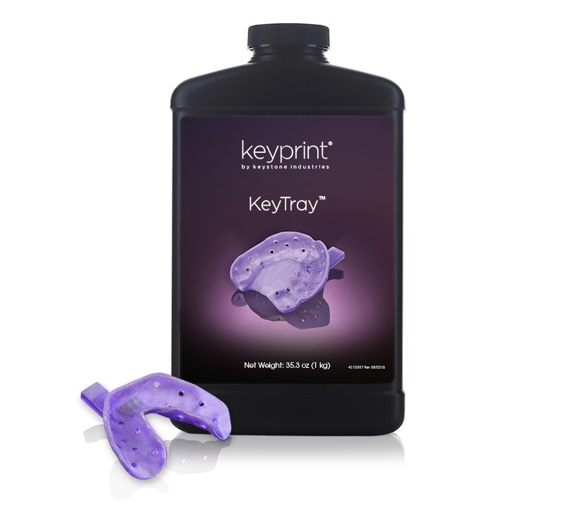 Frasco da resina KeyTray da Keystone ao lado de uma moldeira individual roxa